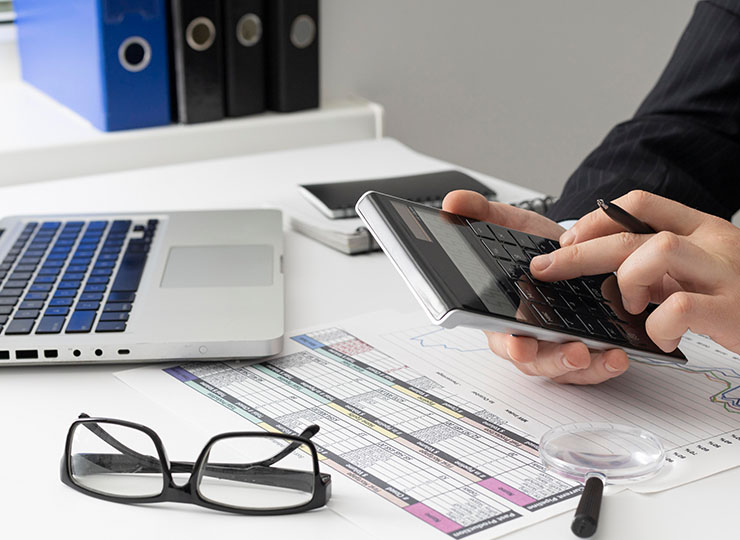 man-typing-calculator